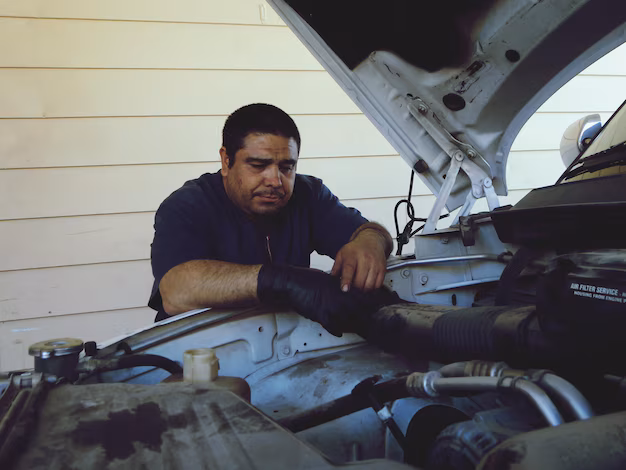 mechanic-repairing-car-engine